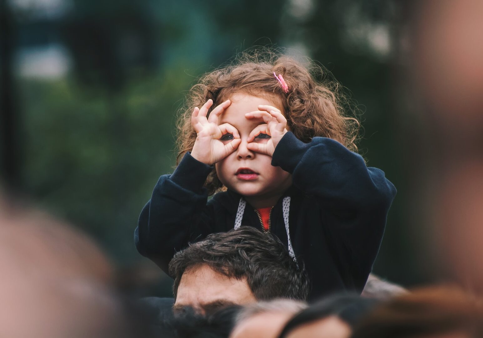 girl making hand gesture on her face