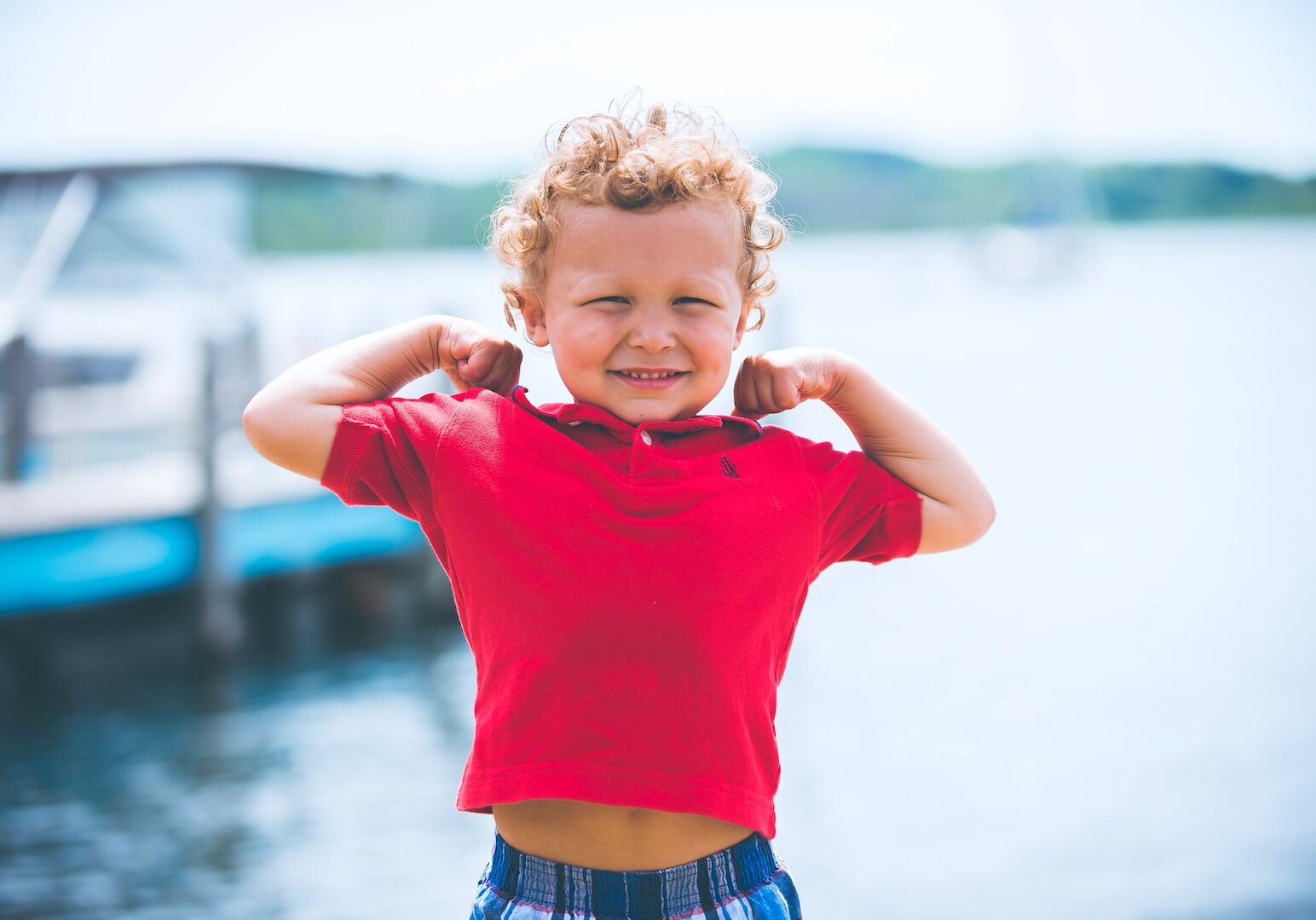 boy standing near dock